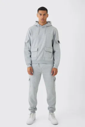 Official Man Regular Fit Panelled Cargo Hooded Tracksuit | boohooMAN UK